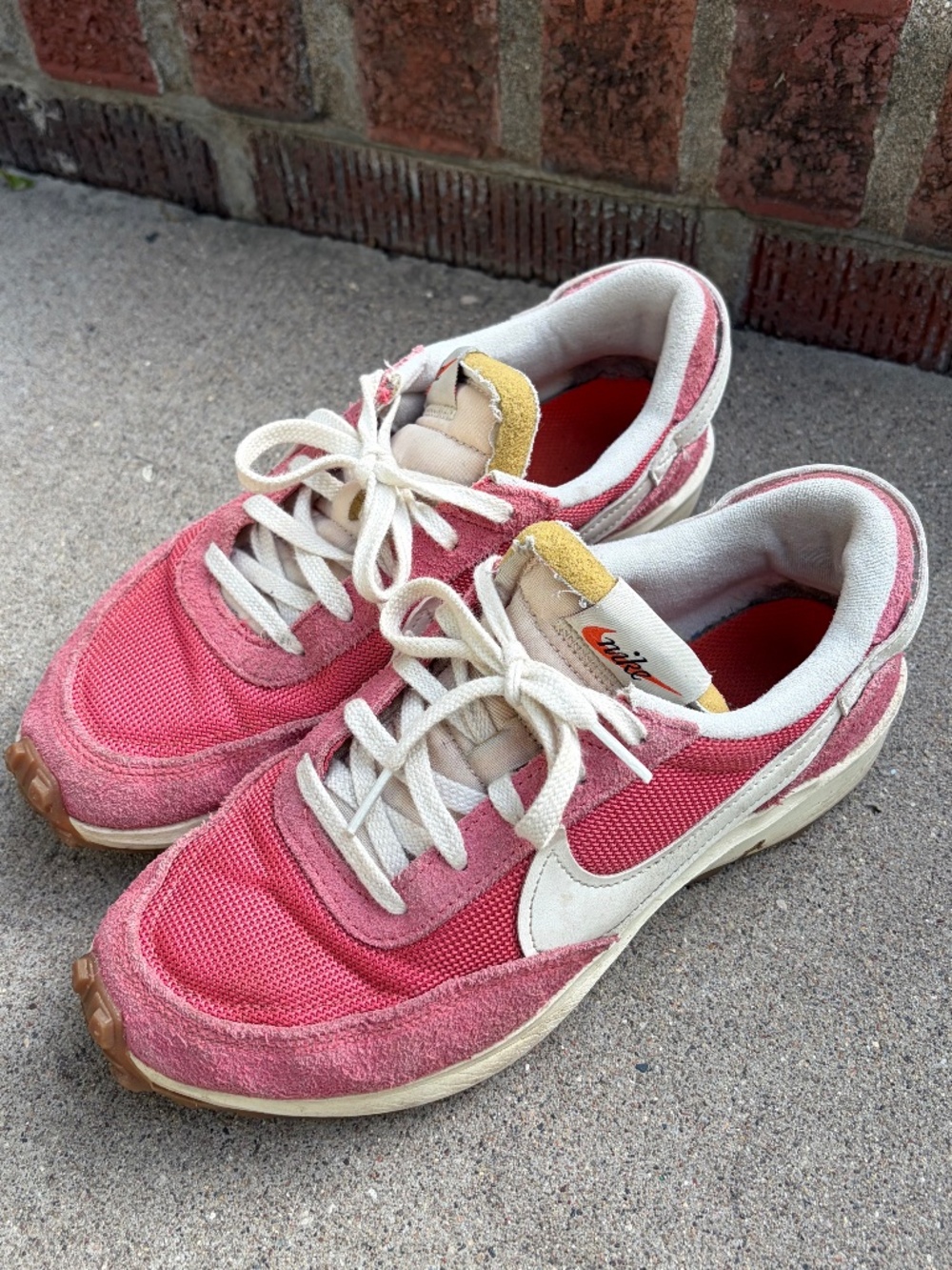 Pink Nikes with gum sole